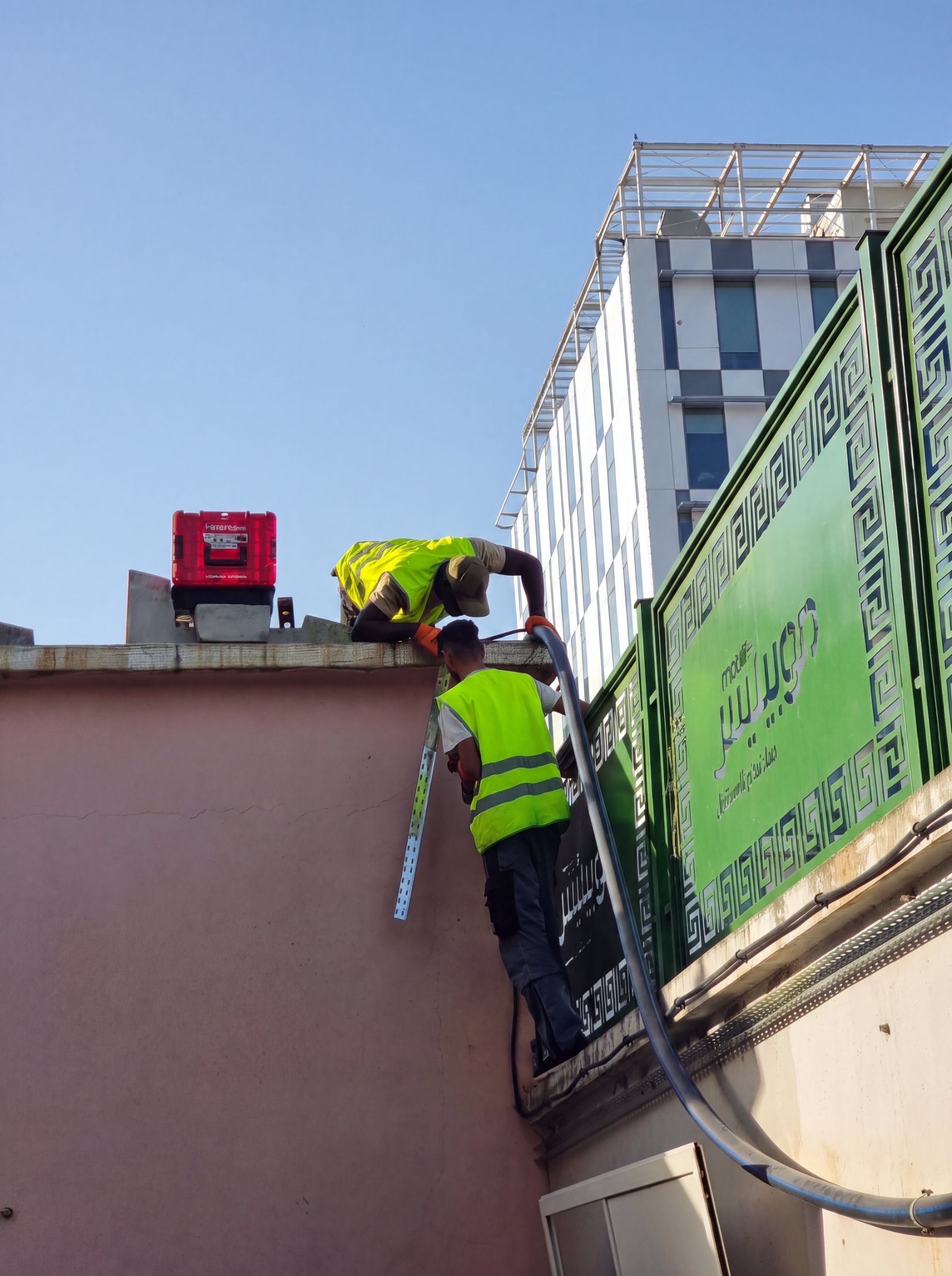 Technician wiring the solar-powered display structure